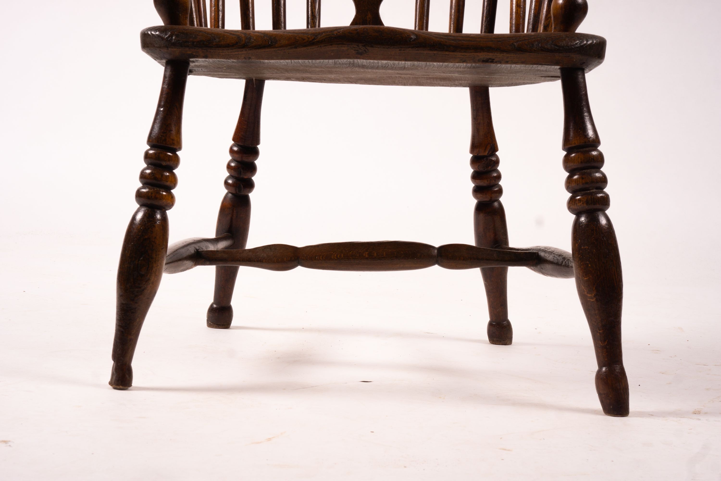 An early 19th century ash, elm and fruitwood Derbyshire area Windsor armchair with 'H' stretcher, width 56cm, depth 44cm, height 106cm